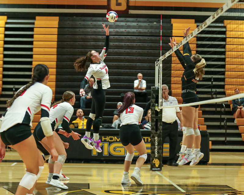 Bolingbrook's Sophia Barrera (5) pushes the ball over the net during regional final volleyball match between Bolingbrook at Joliet West.  Oct 26, 2023.