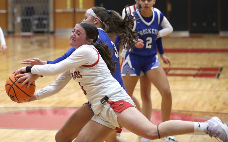 Huntley's Katelyn Diaz battles with Burlington Central's Julia Scheuer for a rebound during a Fox Valley Conference girls basketball game on Tuesday Jan. 13, 2026, at Huntley High School.