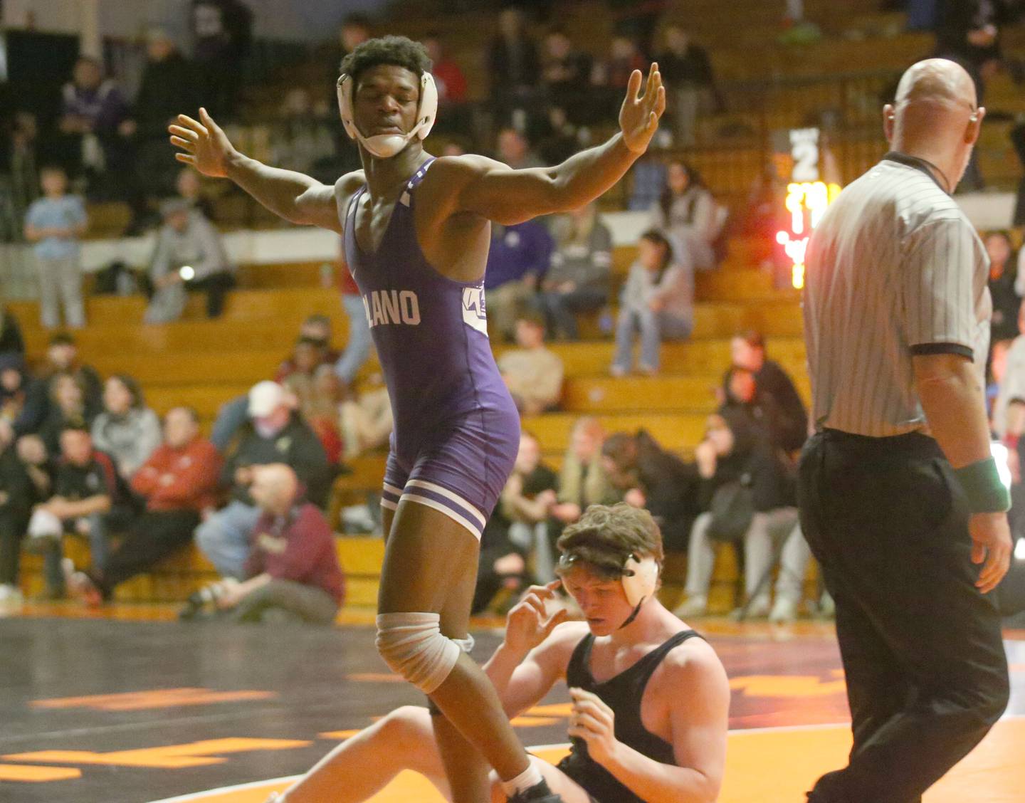 Plano's Prince Amakiri reacts after defeating Yorkvile Christian's Jackson Allen in the 190 weight class during the Class 2A Sectional championship on Saturday, Feb. 15, 2025 at Washington High School.