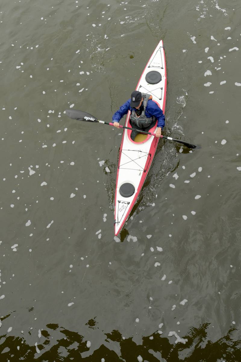 A kayak racer paddles down the Fox River in Batavia during the annual Mid-American Canoe & Kayak on Saturday, June 1, 2024.