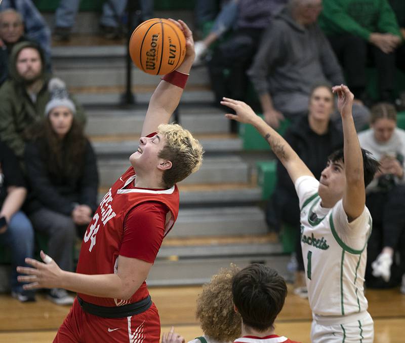 Oregon’s Kade Girton pulls down a rebound against Rock Falls Friday, Jan. 10, 2025 at Rock Falls High School.