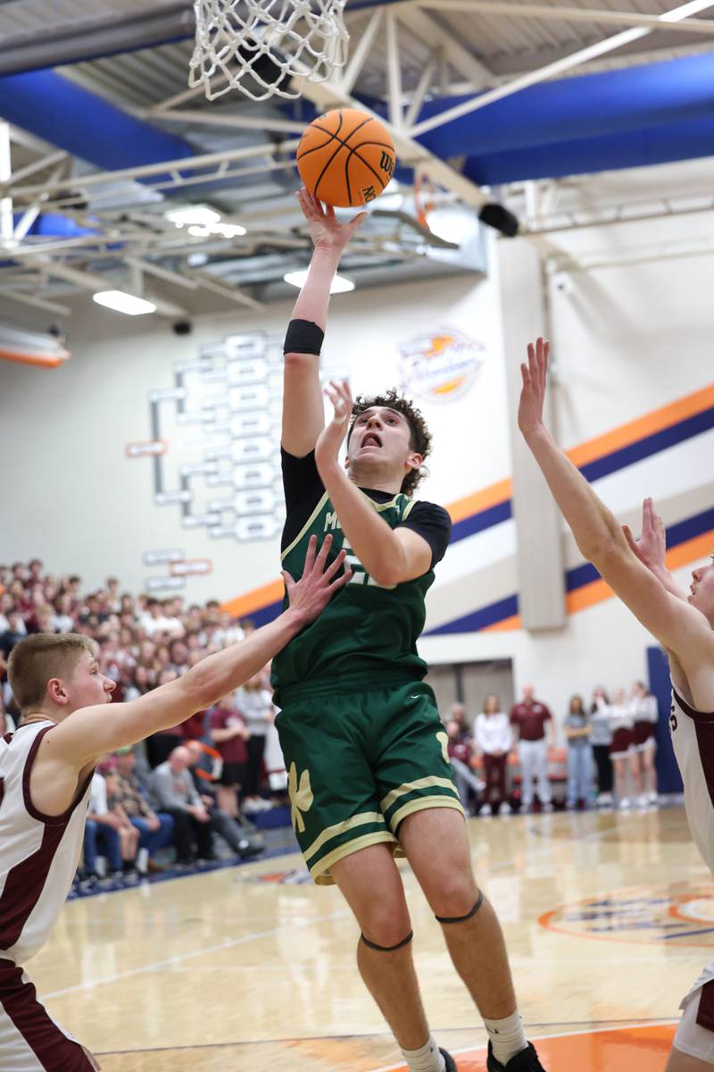 Bishop McNamara's Karter Krutsinger shoots under pressure during the Fightin' Irish's 77-70 loss to Tolono Unity in the IHSA Class 2A Pontiac Supersectional on Monday, March 9, 2026.
