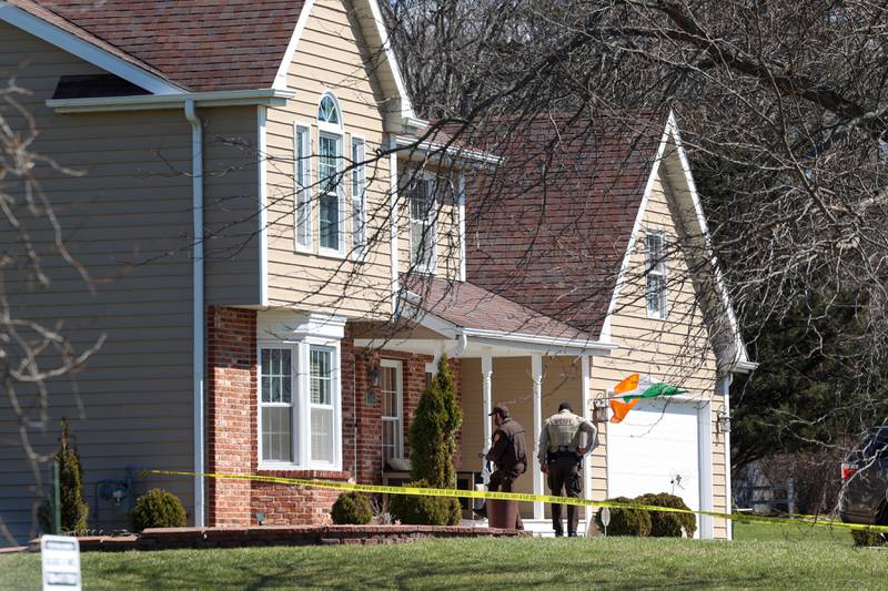 Will County Sheriff's Department officers enter a home in the 3400 block of Norway Trail in Crete Township as they investigate a triple homicide on Monday, March 23, 2026.