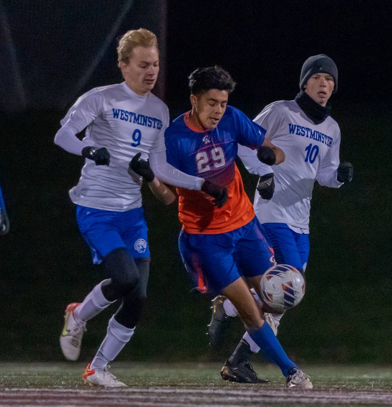 Genoa-Kingston's Max Rodriguez (29) challenges Westminster Christian's Cal Hoon (9) for the ball during a Wheaton Academy 1A sectional semifinal match at Wheaton Academy on Tuesday, Oct 18, 2022.