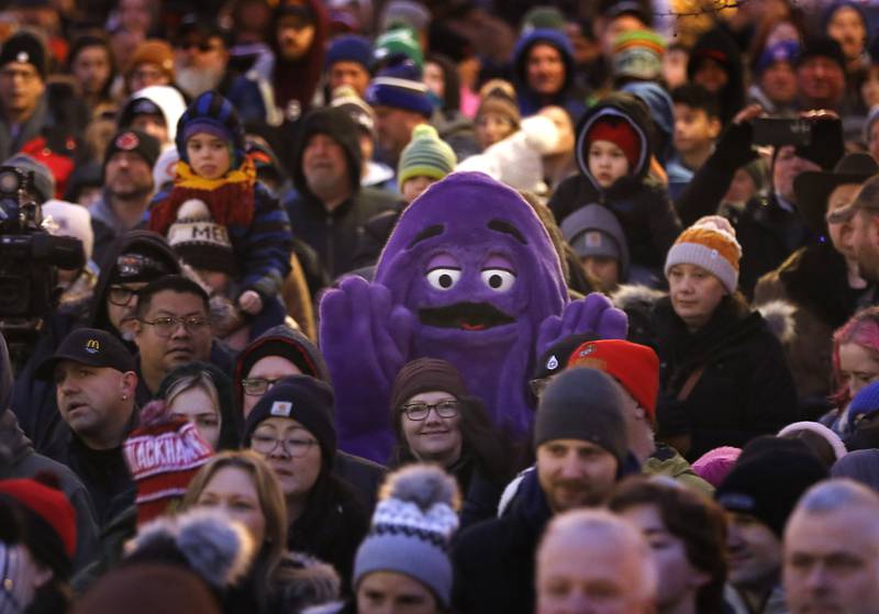 Grimace makes an appearance on Sunday, Feb. 2, 2025, to see if Woodstock Willie will see his shadow during the annual Groundhog Day Prognostication in the Woodstock Square.