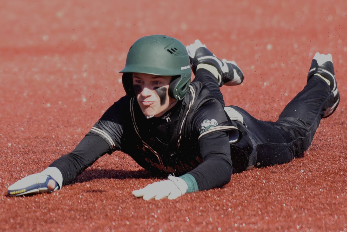 Bishop McNamara's Nick Pignatiello dives into third base during a game at Bradley-Bourbonnais Saturday, March 28, 2026 at 315 Sports Park in Bradley.