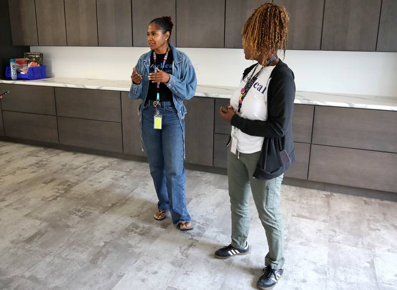 Two of Excelleaf’s owners Crystal Anderson, (left) and Maria Davis talk Friday, June 20, 2025, from what will be the new tasting room at the marijuana dispensary in DeKalb. Tastings would include edible cannabis products only, instead of products to smoke or inhale.