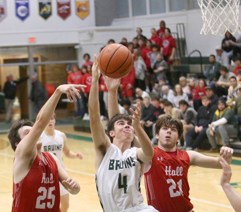 St. Bede's John Brady (center) splits Hall defenders Domonic Galetti (left) and Hunter Meagher (right) as he drives to the basket on Monday, Dec. 14, 2022 at St. Bede Academy.