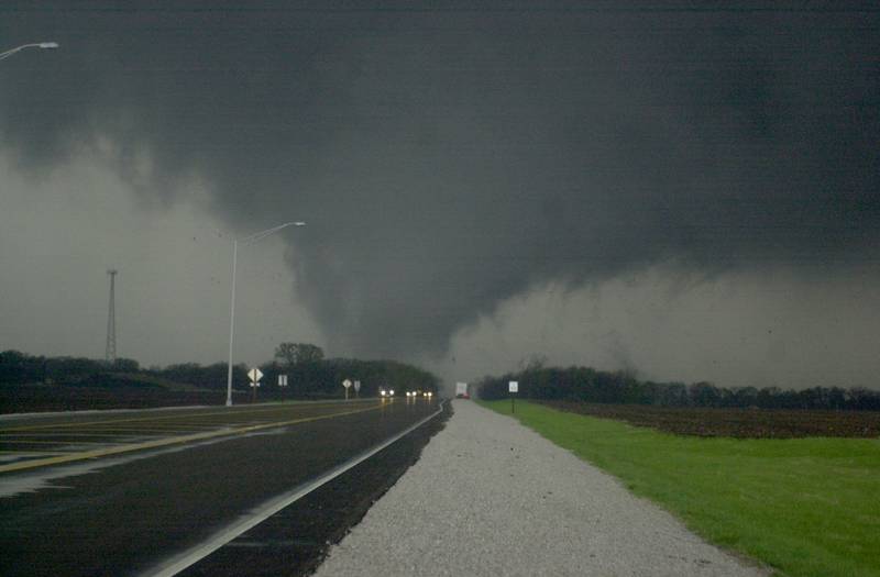 A tornado moves along the Illinois River as it crosses Illinois Route 251 on Tuesday, April. 20, 2004 in Oglesby. The tornado was headed straight for the Village of Utica.