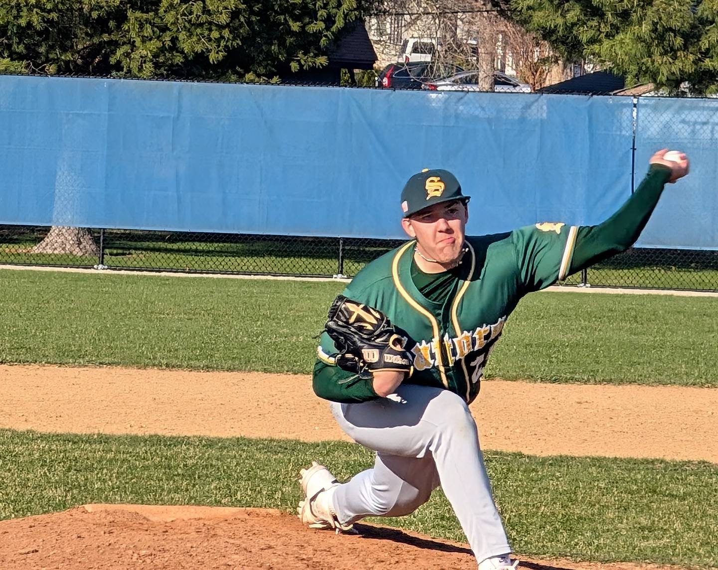 Crystal Lake South's Devin DeLoach delivers to the plate against Dundee-Crown on Tuesday, April 8, 2025, in Carpentersville.