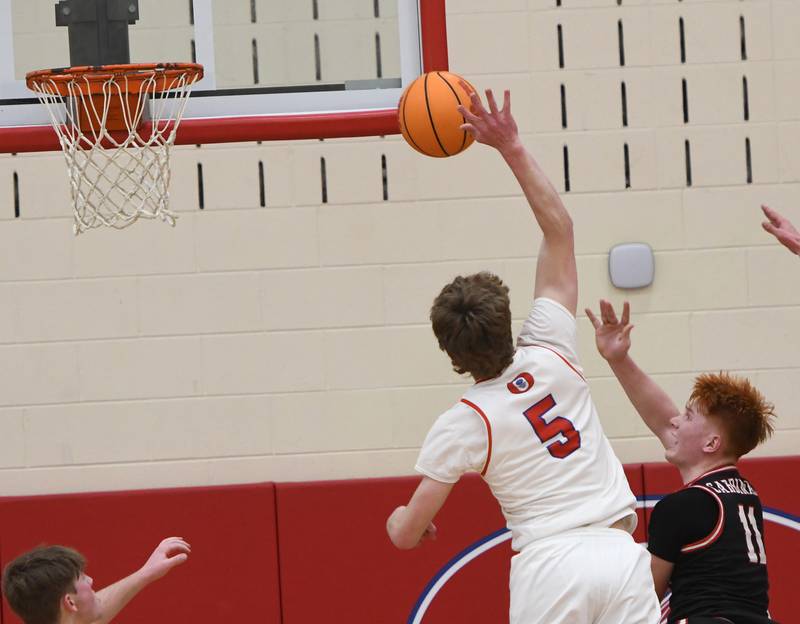 Oregon's Tucker O'Brien gets a piece of a shot by Forreston's Connor Politsch on Tuesday, Feb. 17, 2026 at the Blackhawk Center in Oregon.