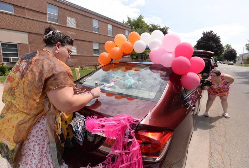 (left) Corrianne Cotton and Christine Feehan of Berwyn decorate their vehicles and participate in the Berwyn Pride Parade Saturday June 15, 2024.
