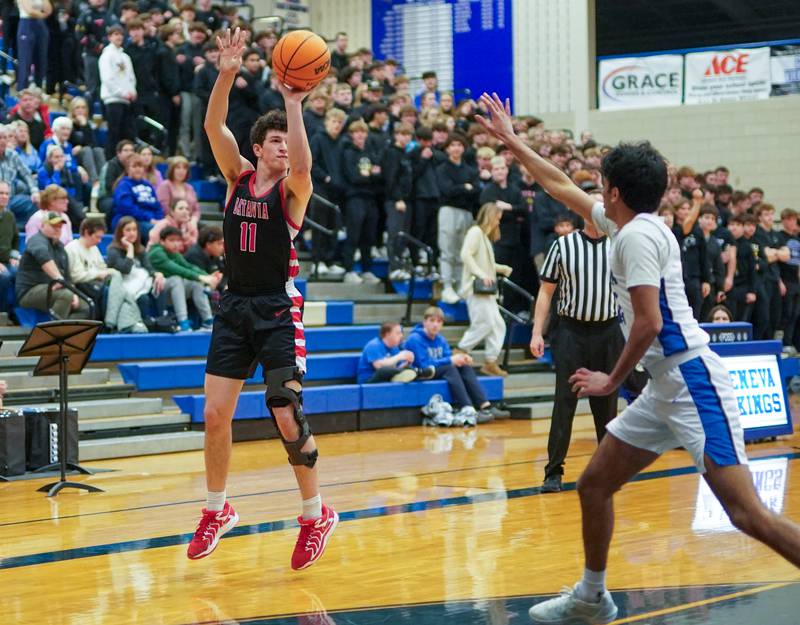 Batavia’s Josh Kahley (11) shoots a three pointer against Geneva during a basketball game at Geneva High School on Friday, Feb. 7, 2025.