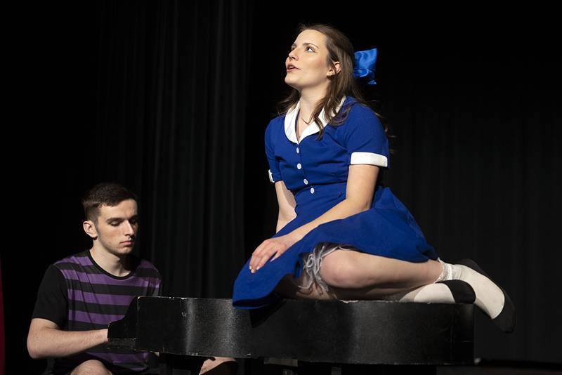 Playing Lucy, Gianna Sagel serenades Schroeder, Liam Schmall, Tuesday, March 7, 2023 during a scene for Newman High School’s “You’re a Good Man Charlie Brown.” Performances will be March 9, 10 and 11 at 7 pm and March 12 at 2 pm at the Jerry Mathis Theatre at Sauk Valley College.
