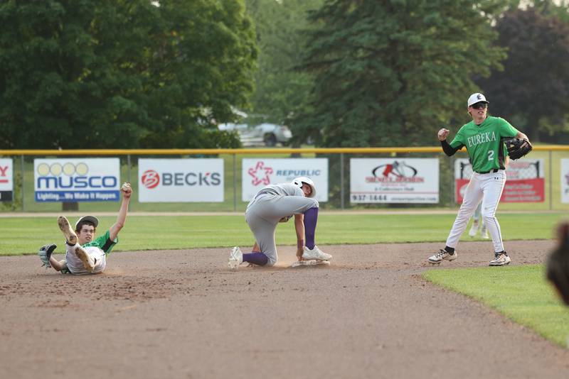 Wilmington's Cooper Holman and Eureka players look to the umpire after a play at second base during the Wildcats' 4-0 loss to Eureka in the IHSA Class 2A Geneseo Super-Sectional on Monday, June 2, 2025. Holman was tagged out in the diving play.