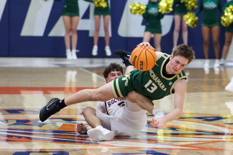 Bishop McNamara's Teddy Fogel topples over Tolono Unity's Brayden Henry during the Fightin' Irish's 77-70 loss to Tolono Unity in the IHSA Class 2A Pontiac Supersectional on Monday, March 9, 2026.
