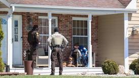 Woman in custody after 3 people found dead inside Crete Township home