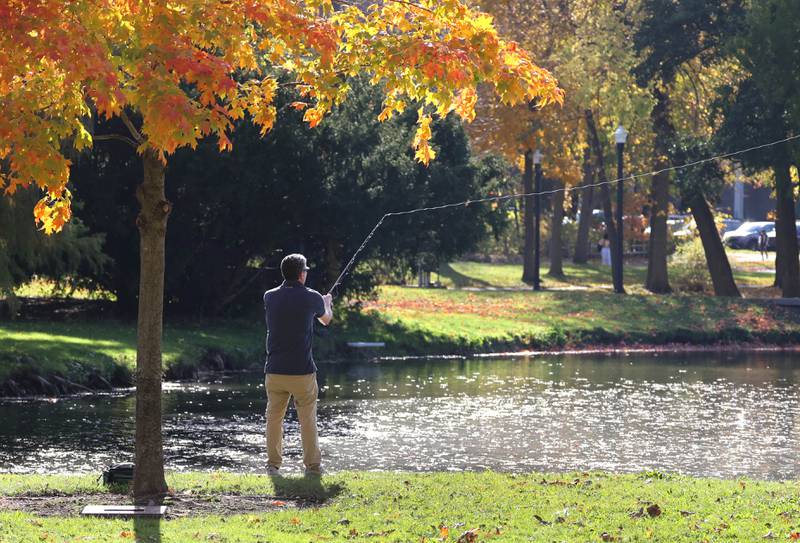 Matt O’Connell, a masters student at Northern Illinois University from Barrington, does some fishing Tuesday, Oct. 24, 2023, in the lagoon at NIU in DeKalb.