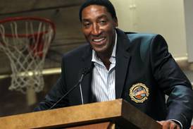 Scottie Pippen takes another kind of shot, to sign bottles of his bourbon Thursday at Richmond store