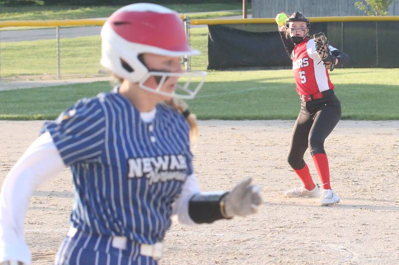 Earlville's Bailey Miller throws to first late as Newark's Presley Hauge reaches the bag safely during the Class 1A Regional final on Thursday, May 22, 2025 at Indian Creek High School in Shabbona.
