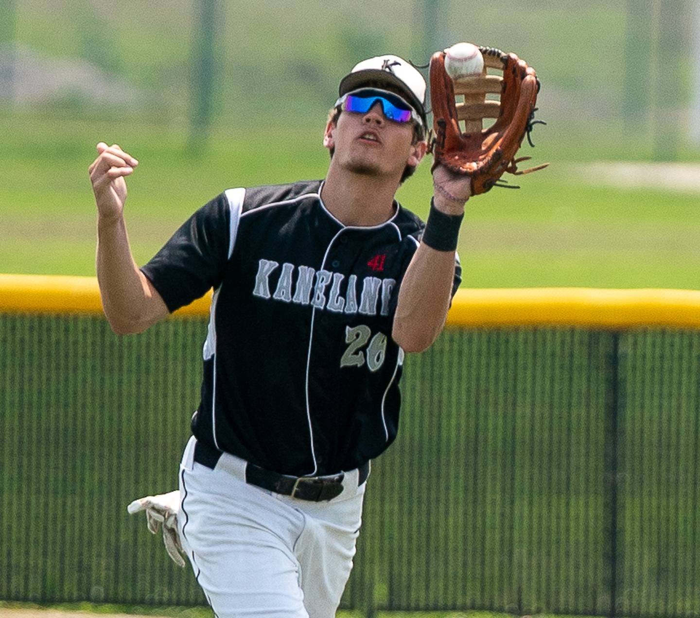 Kaneland’s Parker Violett (26) catches a fly-ball for an out against Benet during the Class 3A Kaneland Regional baseball final at Kaneland High School in Maple Park on Monday, May 30, 2022.