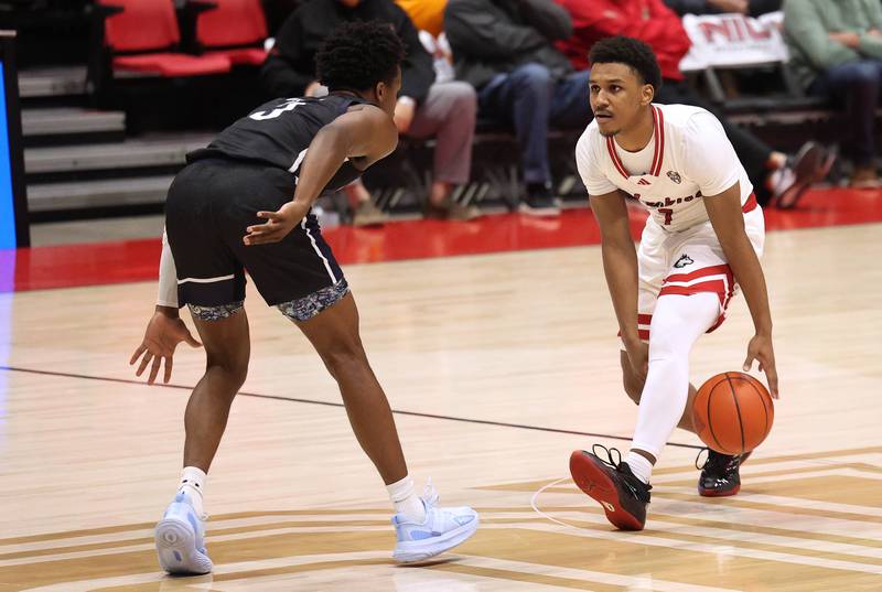 Northern Illinois' Nasir Muhammad dribbles between his legs as he brings the ball upcourt during their game Tuesday, Nov. 12, 2024, in the Convocation Center at NIU in DeKalb.