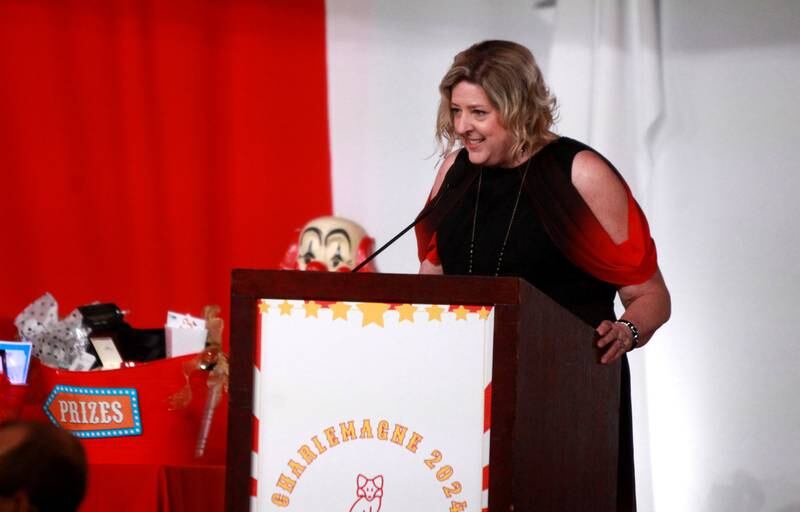 Deborah Gurley, executive director of the St. Charles Chamber of Commerce, addresses the audience during the 56th Annual Charlemagne Awards Dinner at the Q Center in St. Charles on Friday, May 17, 2024.