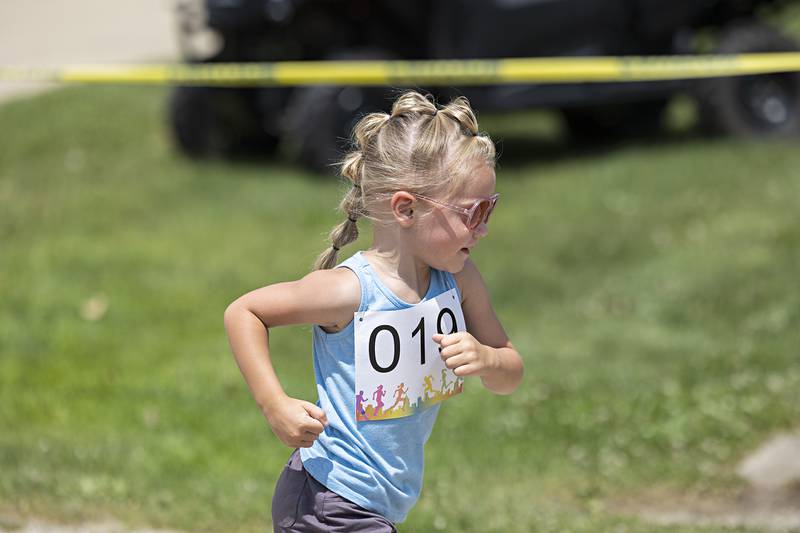 A young competitor eyes the finish during the youngest age group in the Tampico Days fun run Saturday, July 22, 2023.