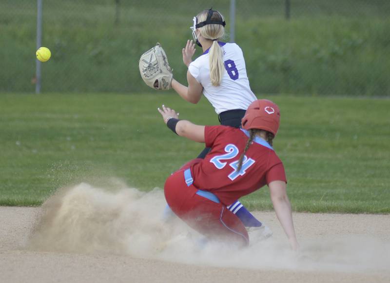 Ottawa’s Bobbi Snook slides in safely for a double as Rochelle’s Camryn Metzger  awaits the throw Wednesday at Ottawa.