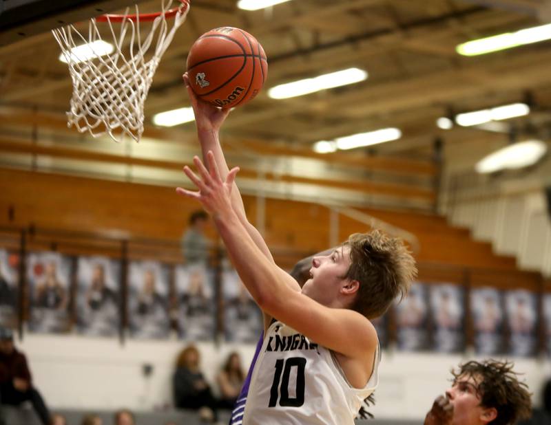 Kaneland’s Troyer Carlson puts up a shot during a game against Plano in Maple Park on Tuesday, Dec. 20, 2022.
