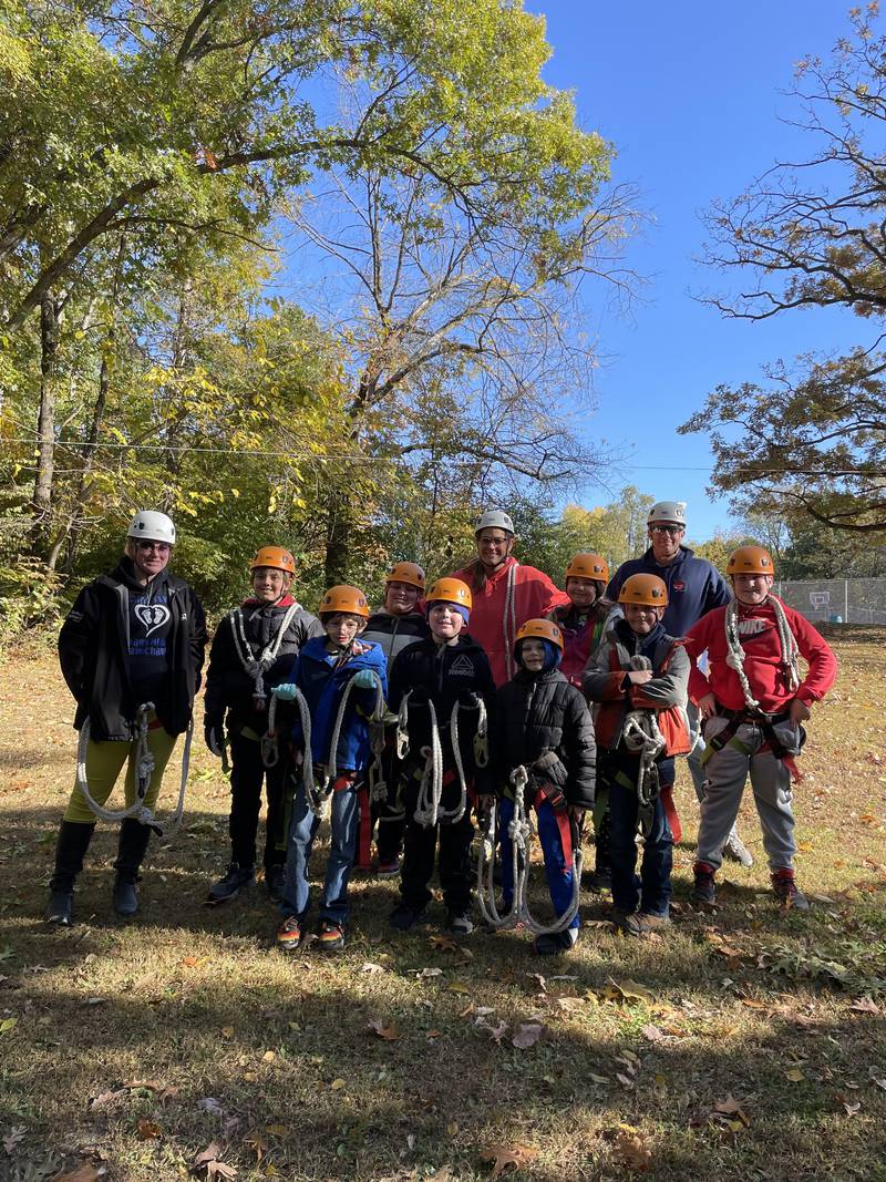 Classroom teachers Taylor Nowakowski, Christine Mitchell, and Jason Darnell, along with students Jacob Binert, Cole Santee, Izan Bradley, Nathan Sward, Ashton Supancic, Chevelle Heinz, Jackson Floto, and Isaac Diveley get ready for some hands on learning and challenges at Echo Bluffs