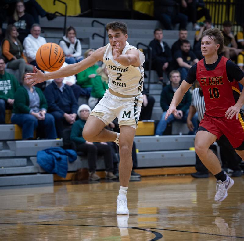 Bishop McNamara's Gavin Antons, left, tries to run down a pass as St. Anne's Grant Pomaranski, right, follows in a game on Wednesday, November 26, 2025.