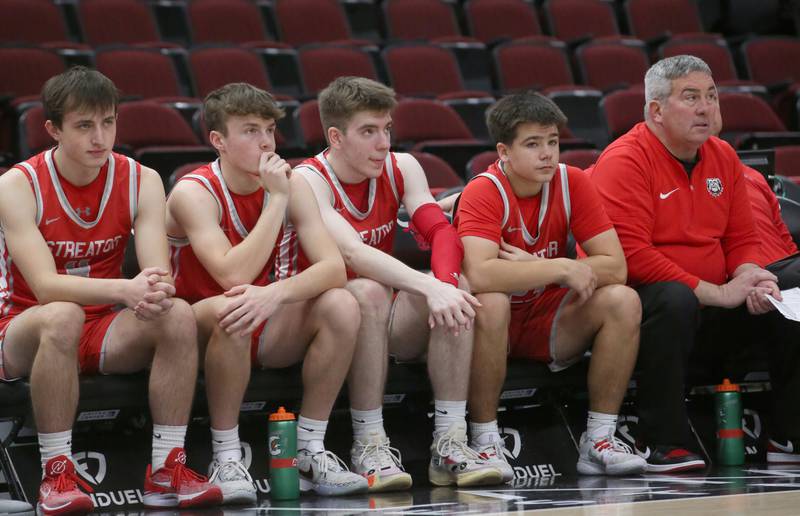 Members of the Streator boys basketball team watch their peers play from the bench during a game on Tuesday, Dec. 21, 2023 at the United Center in Chicago.
