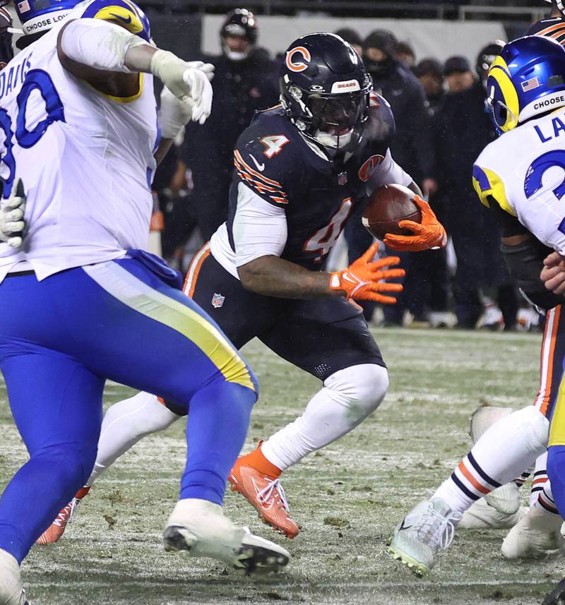 Chicago Bears running back D'Andre Swift looks for a opening in the Los Angeles Rams defensive line Sunday, Jan. 18, 2026, in their NFC divisional playoff matchup at Soldier Field in Chicago.