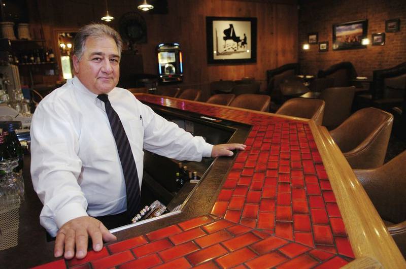 Adam Salerno in the lounge of his restaurant, Salerno's on the Fox, in June 2004.