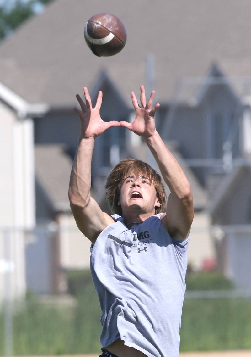 Sycamore's Eli Meier makes a jumping catch during a defensive back drill Monday, June 27, 2022, at football practice at the school.