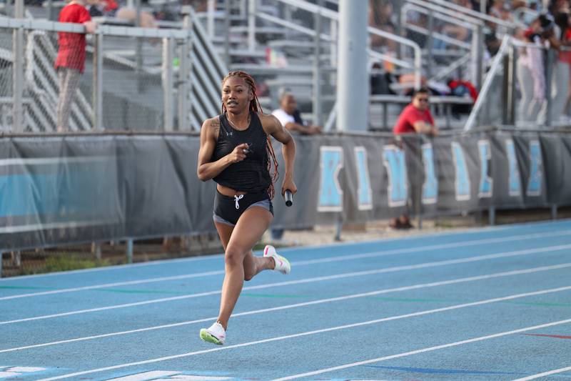 Kankakee's Naomi Bey-Osborne secures first place for the Kays in the girls 4x100 relay during the All-City meet at Kankakee High School on Monday, April, 28, 2025.
