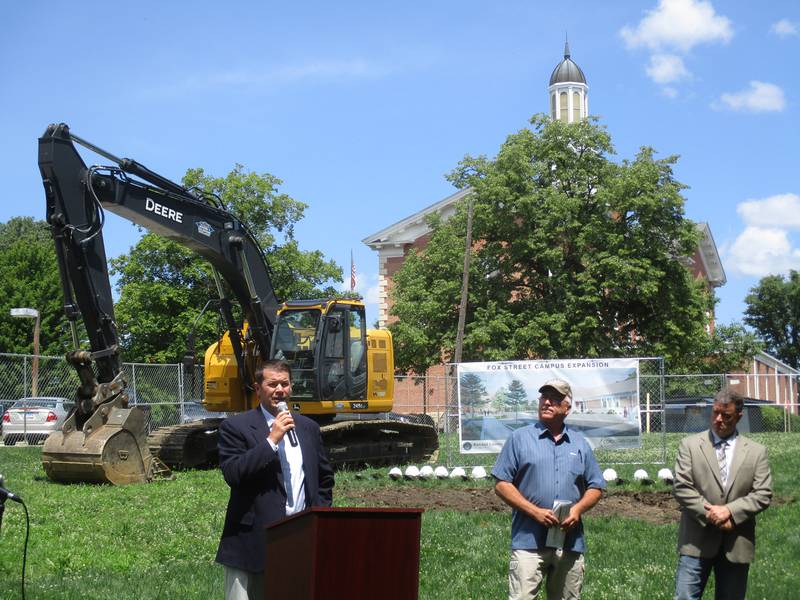 Kendall County Board Finance Committee Chairman Scott Gengler speaks at the groundbreaking ceremony for the downtown Yorkville campus expansion on July 18, 2023, as County Board Facilities Management Committee Chairman, Brian DeBolt, center, and County Board Chairman Matt Kellogg listen.