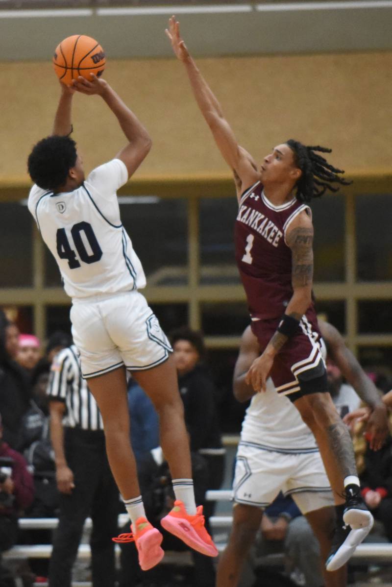 Kankakee's Lincoln Williams, right, defends a shot from DePaul Prep's Zion Lee during a game at the Team Rose Shootout at Mount Carmel Sunday, Dec. 14, 2025.