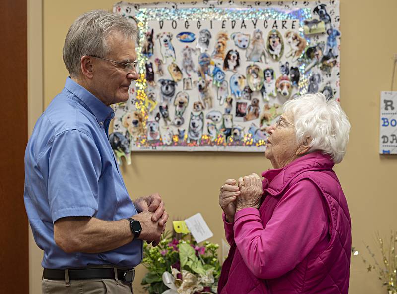 Dr. Bill Kuhfus speaks with Delores Meiners of Ashton Thursday, Dec. 28, 2023 during an open house at River Ridge Animal Hospital in Dixon. Kuhfus is retiring after 40 years of practice.