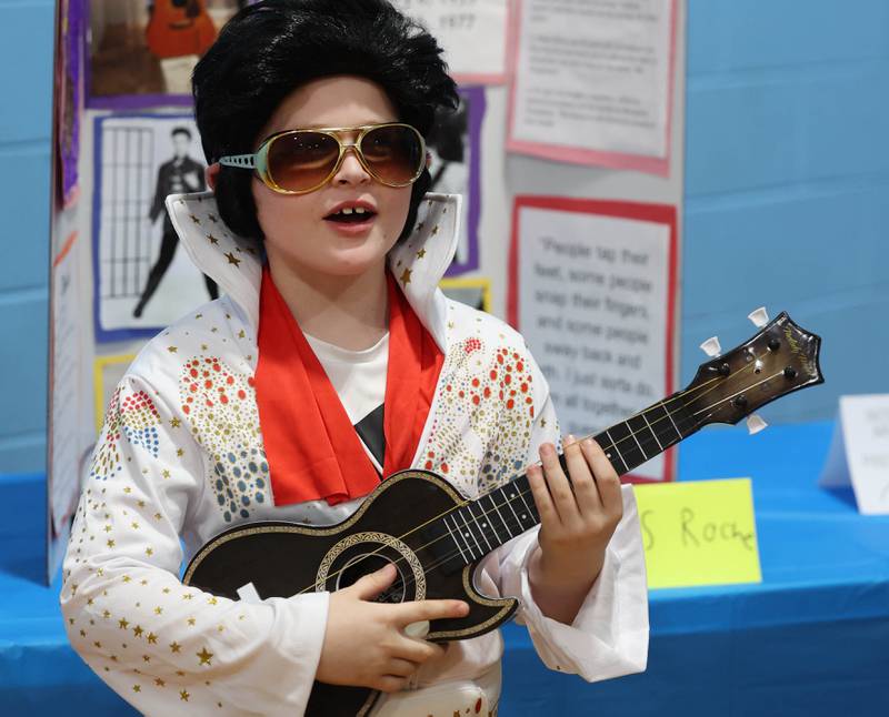 Third grader Chris Roche, who is portraying Elvis, gives his presentation during the Hinckley Big Rock Elementary School Wax Museum Thursday, March 13, 2025, at the school in Hinckley.