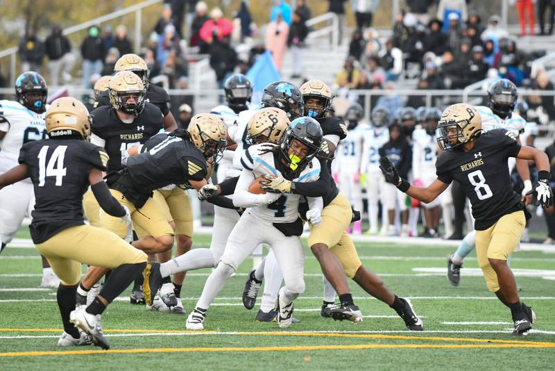 Kankakee's James Stampley is taken down by Richards defenders Saturday during the Kays' 21-20 loss in the Class 6A quarterfinal at Richards.