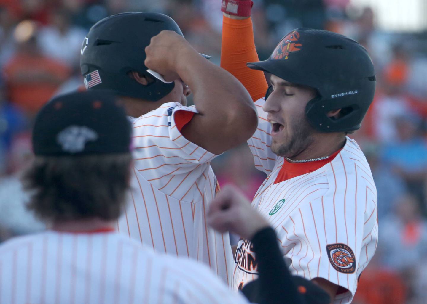 Pistol Shrimp's Ryan Niedzweidz of North Aurora, hi-fives teammates after hitting a solo home run against Rex during the Prospect League Championship Series  on Wednesday, Aug. 7, 2024 at Schweickert Stadium in Peru.