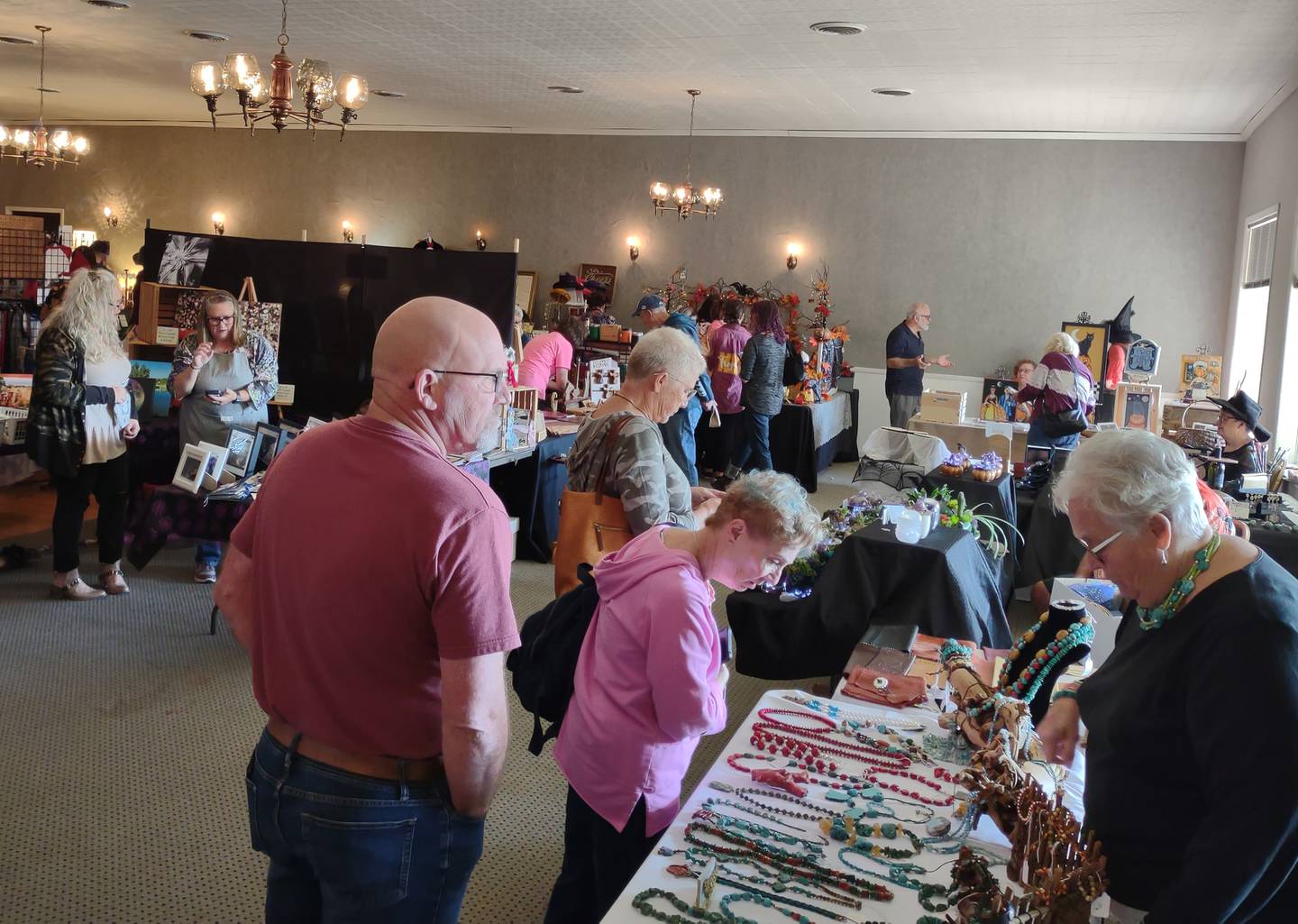 Shoppers browse vendors' wares Saturday, Oct. 22, 2022, during the Witches Day Out market at Pitstick Pavilion in Ottawa.