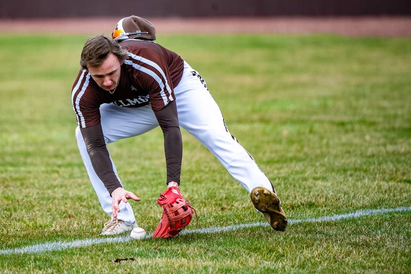 Joliet Catholic Academy's Trey Swiderski fields a ball during a game against  Lockport Friday March 24, 2023 at Flink Field in Lockport