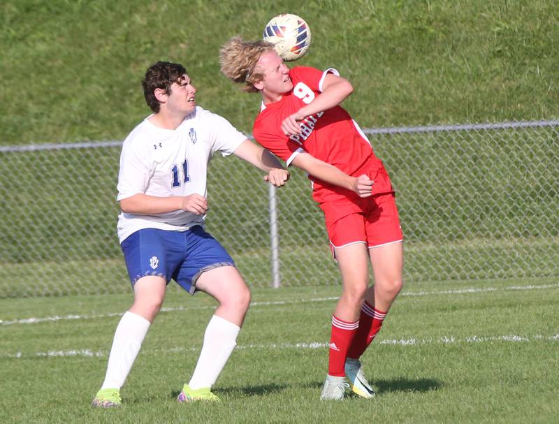 Ottawa's Grayson Skinner puts a header on the ball over Princeton's Levi Boggs on Tuesday, Oct. 3, 2023 at Ottawa High School.