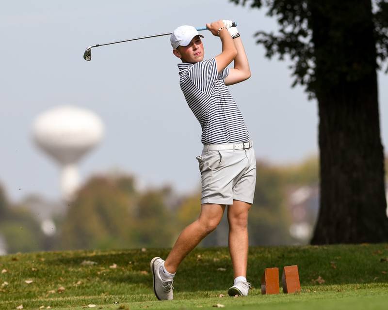 Jax Baker of Oswego watches his ball after teeing off the tee box during the Plainfield Central regional on Wednesday Oct. 1, 2025, held at Wedgewood Golf Course in Plainfield.