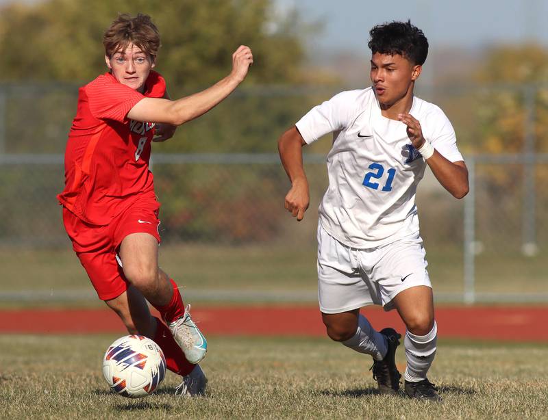 Huntley’s Gavin Eagan, left, races Larkin’s  Joel Gutierrez for the ball in boys soccer regional action at South Elgin on Saturday.