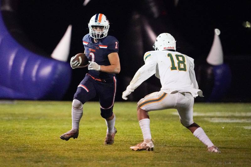 Oswego’s Lucas Andersen (2) runs after the catch against Waubonsie Valley's Josh Hung (18) during a Class 8A first-round playoff game at Oswego High School on Friday, Nov. 1, 2024.