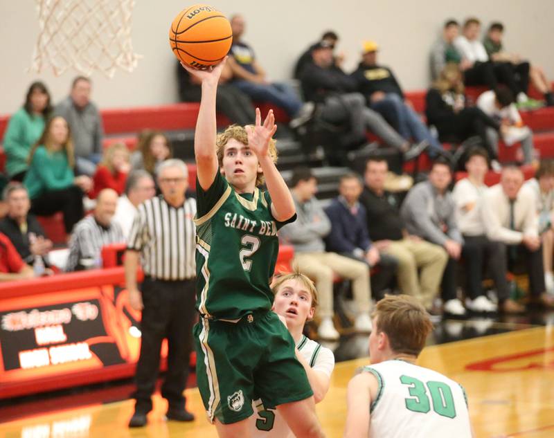 St. Bede's Kaden Nauman lets go of a shot over Eureka's Cooper Peterson and Brock Monk during the 50th annual Colmone Classic on Monday, Dec. 9, 2024 at Hall High School.